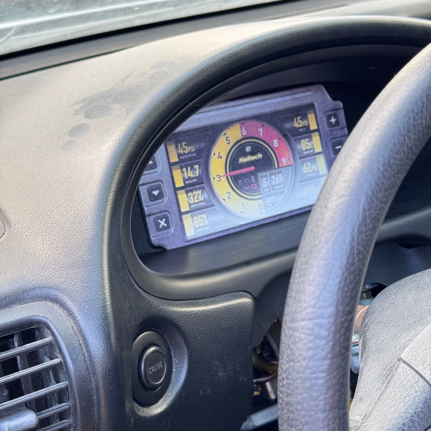 Acuta integra Car dashboard with a haltech ic7 digital display and steering wheel